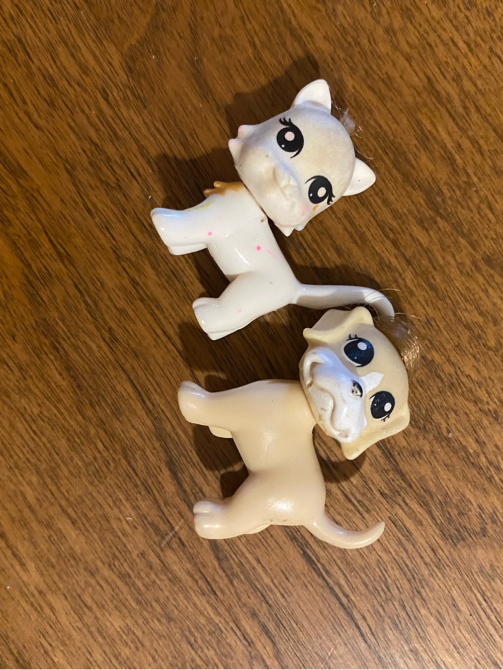 Pair of Polly Pocket Littlest Pet Shop toys featuring a cat and a pug dog.